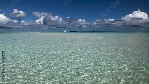 White sand and transparent sea water. Nosy Iranjia near Nosy Be in Madagascar. Two islands connected by a tongue of sand influenced by the tide. Typical Malagasy boat. Panoramas of Madagascar.  Love.