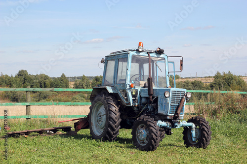 Blue tractor in the field.