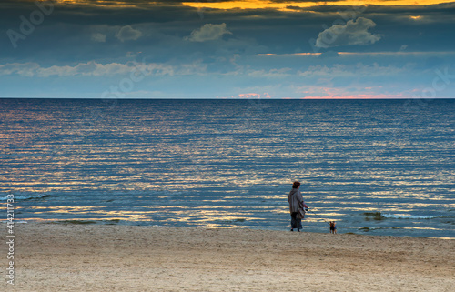 Evening walks on sandy beach of the Baltic Sea, Jurmala, Latvia