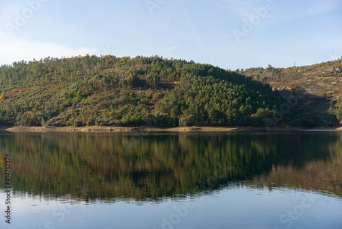 Apartadura dam nature landscape with reflection on the still water in Sao Mamede, Alentejo, Portugal