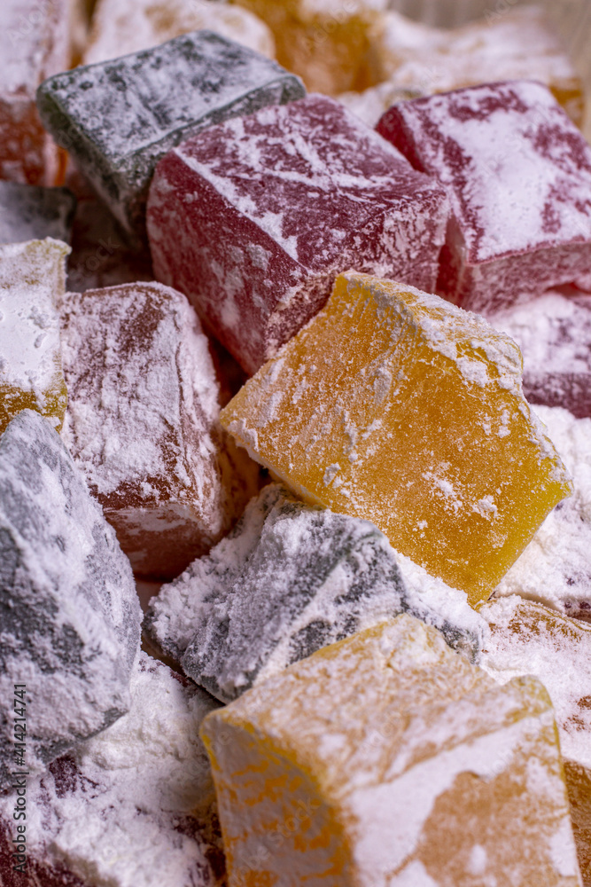multicolored turkish delight in powdered sugar close-up multicolored turkish delight in powdered sugar close-up