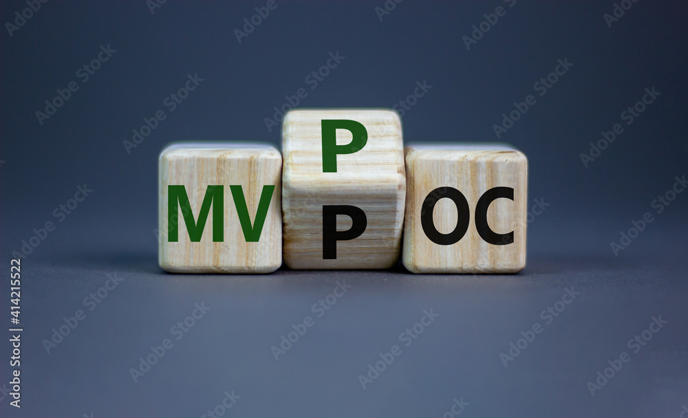 MVP vs POC symbol. Businessman turns the cube. changes words MVP, minimum viable product to POC, proof of concept. Beautiful grey background. Business and MVP vs POC concept, copy space. MVP vs POC symbol. Businessman turns the cube. changes words MVP, minimum viable product to POC, proof of concept. Beautiful grey background. Business and MVP vs POC concept, copy space.