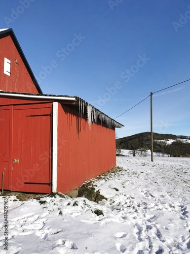 red barn in snow © faweber