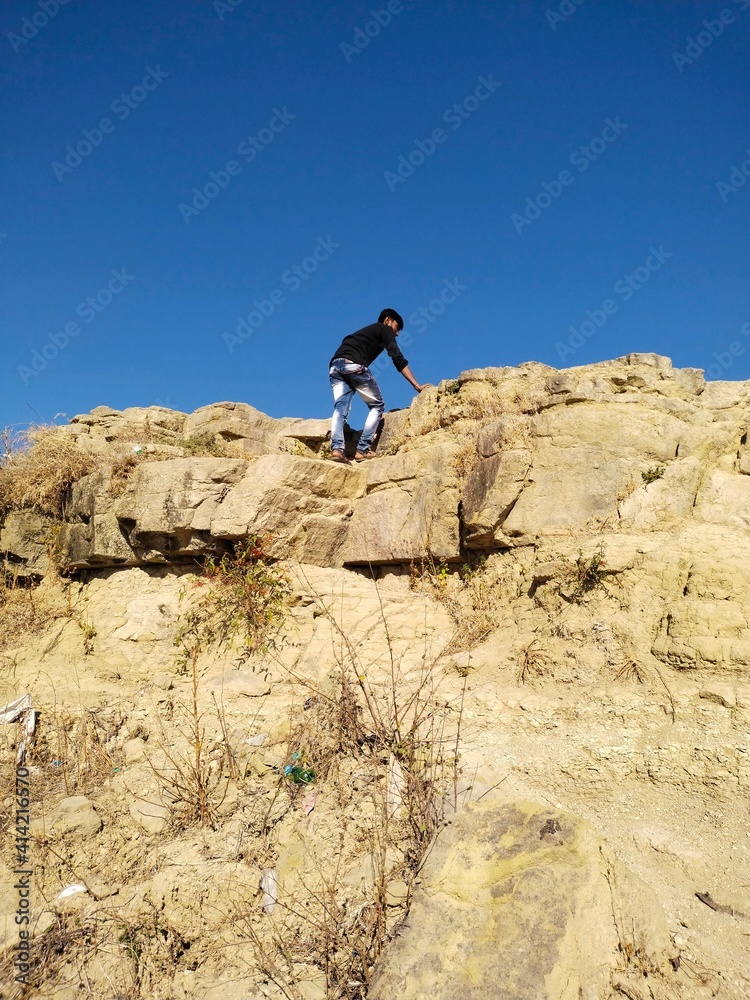 hiker on the top of mountain