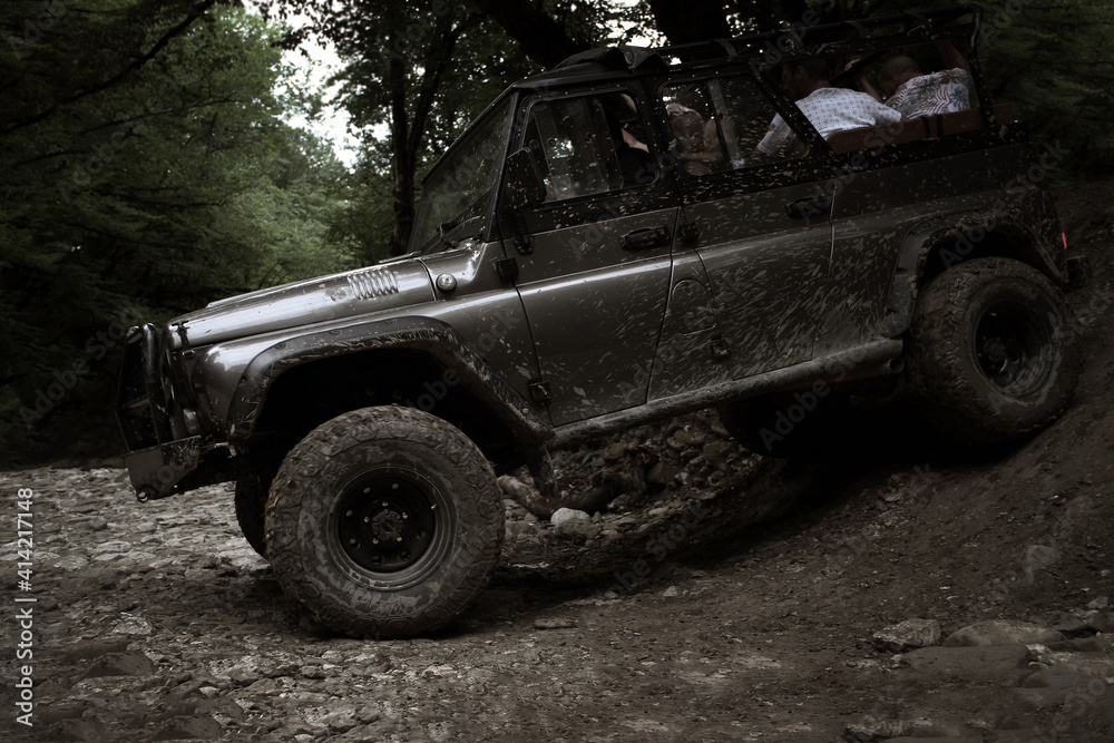 Fototapeta premium Russian SUV in the forest