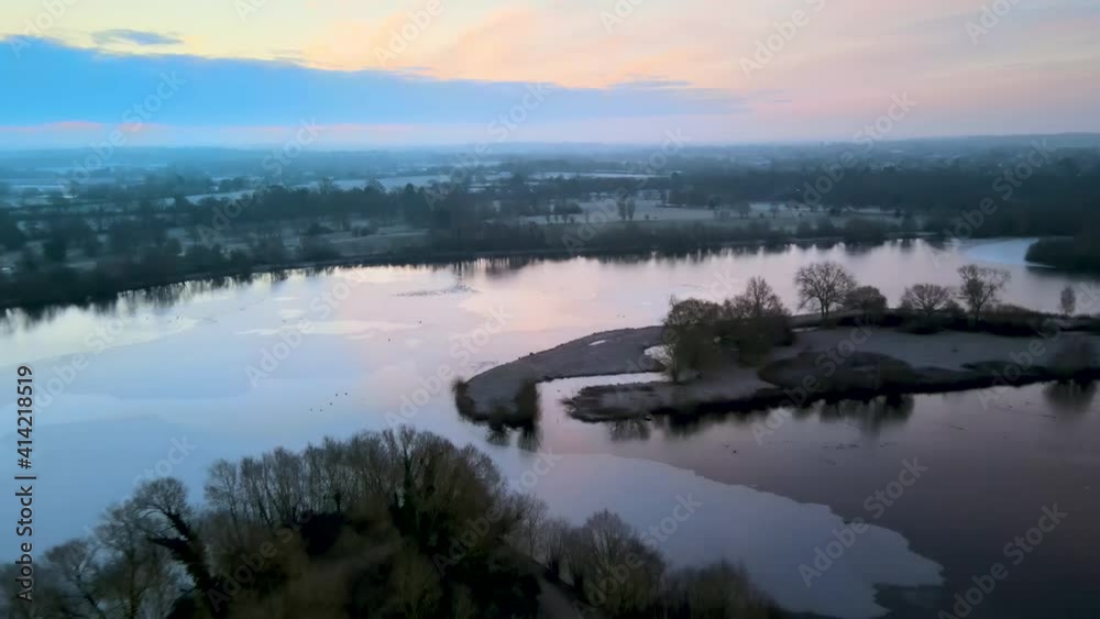 Aerial view over frozen lake and countryside Aerial view over frozen lake and countryside