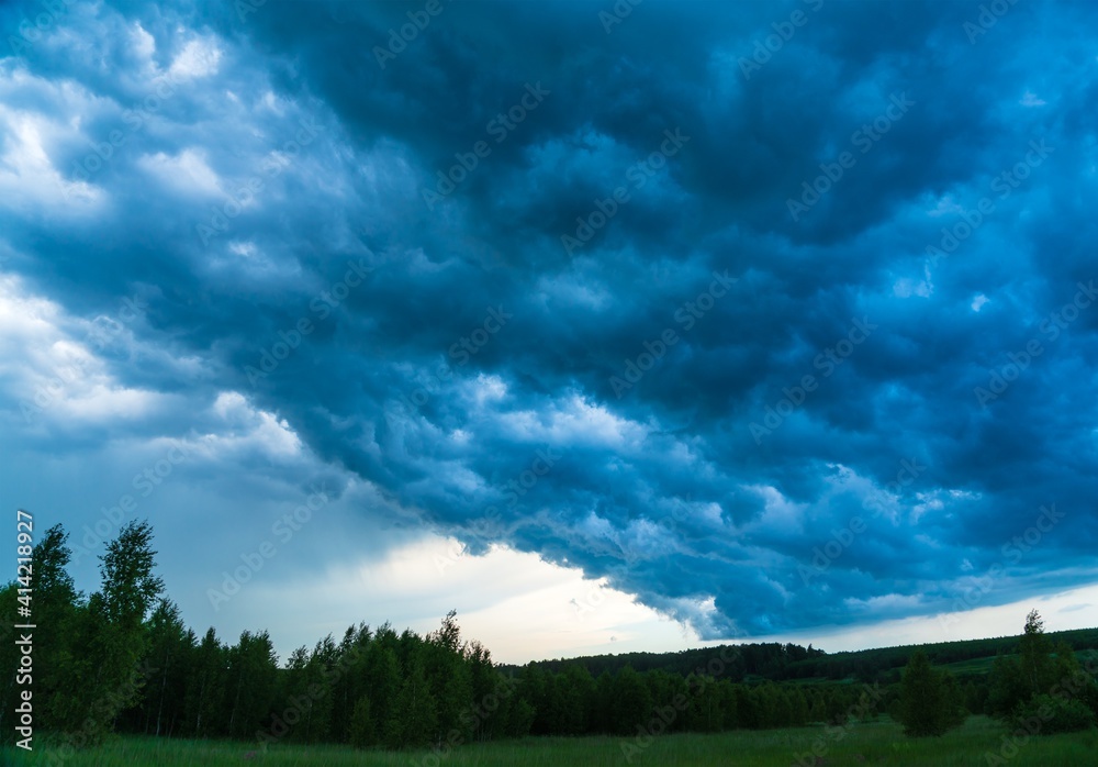 Dark stormy sky before a thunderstorm in the countryside Dark stormy sky before a thunderstorm in the countryside