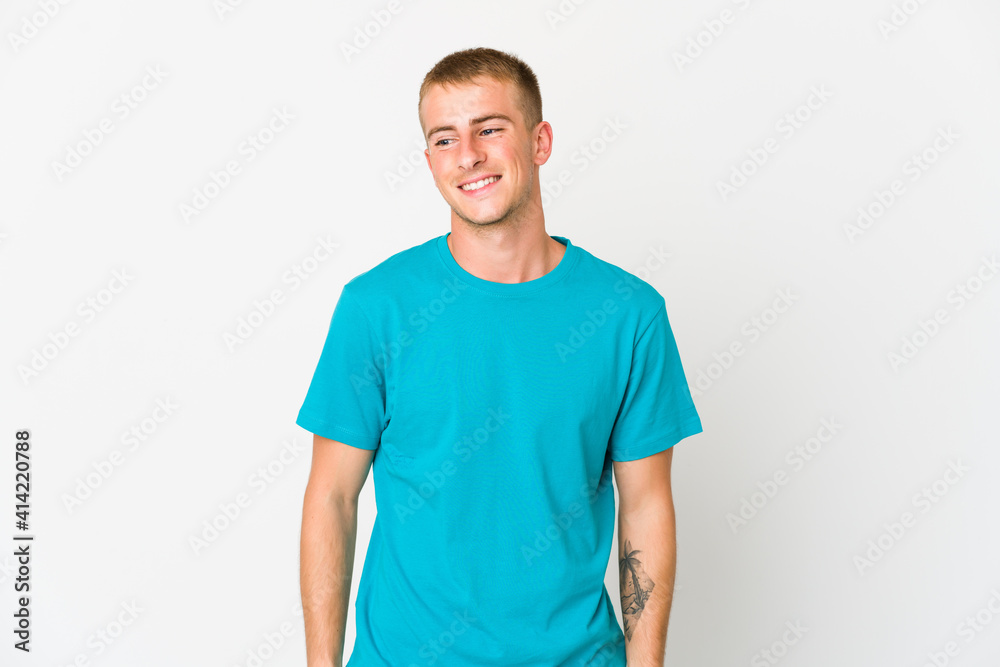 Young caucasian handsome man laughs and closes eyes, feels relaxed and happy. Young caucasian handsome man laughs and closes eyes, feels relaxed and happy.