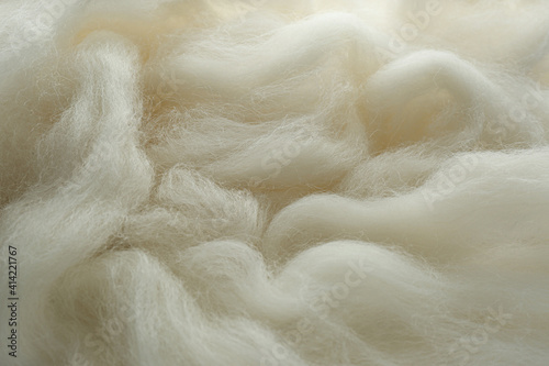 Soft white wool texture as background, closeup photo