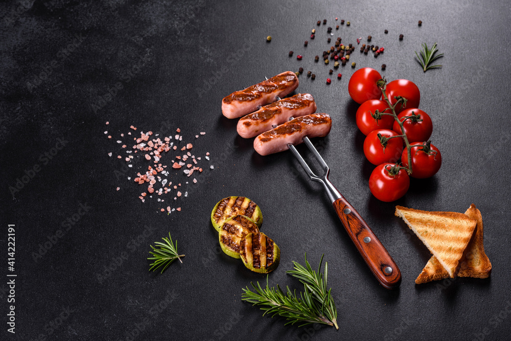 Tasty, fresh sausages grilled with vegetables spices and herbs Tasty, fresh sausages grilled with vegetables spices and herbs