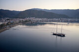 Aerial view of boats, mountains and city at sunset. Landscape view of resort town of Marmaris, Turkey.