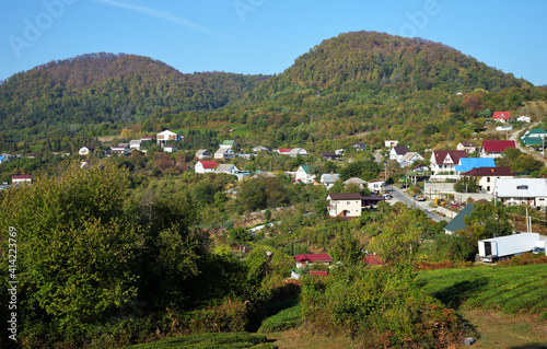 Verkhnearmyanskaya Khobza Village and Caucasus mountains view, Lazarevsky district, resort town Sochi, Krasnodar Territory, Russia photo