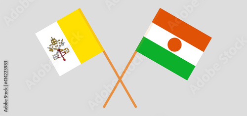 Crossed flags of Vatican and Niger. Official colors