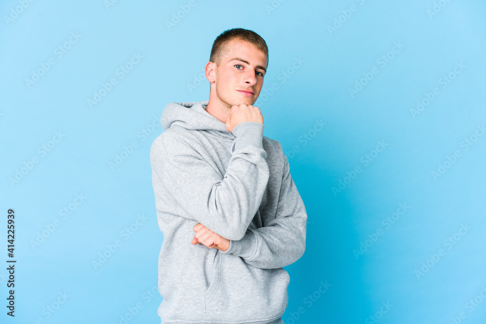 Young caucasian handsome man smiling happy and confident, touching chin with hand. Young caucasian handsome man smiling happy and confident, touching chin with hand.