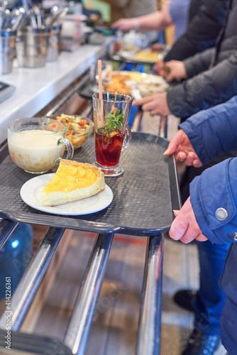 Fototapeta The queue at the checkout in the gastronomic cafe