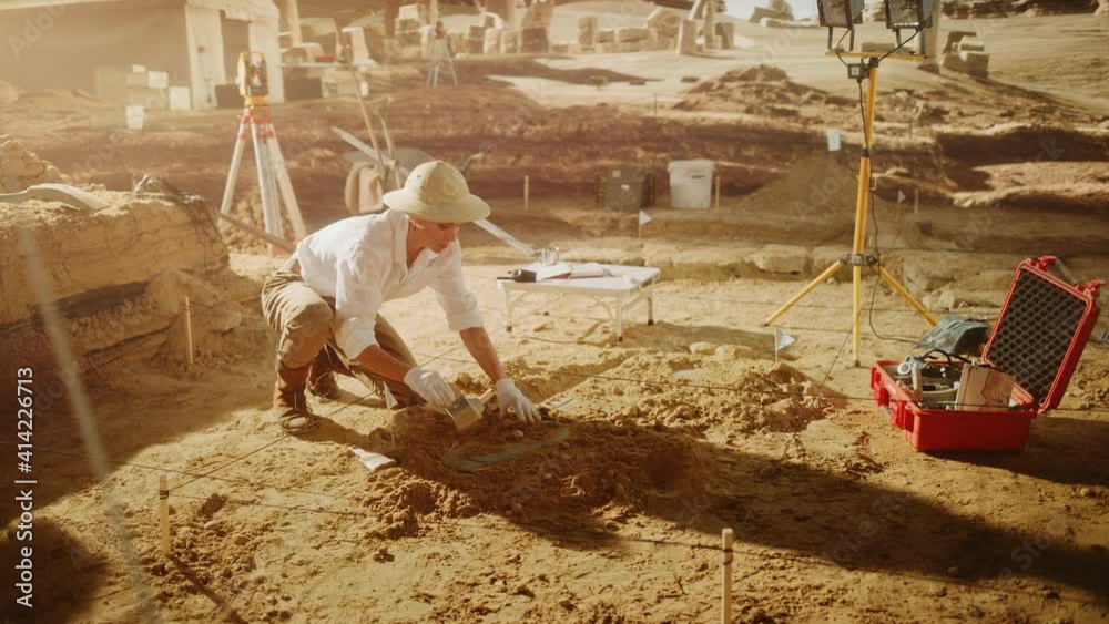 Archaeological Digging Site: Great Female Archeologist Work on Excavation Site, Cleaning Cultural Artifacts with Brush and Tools. Discovery of Ancient Civilization Temple, Architecture, Fossil Remains