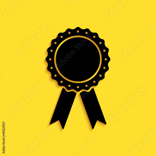 Black Medal badge with ribbons icon isolated on yellow background. Long shadow style. Vector.