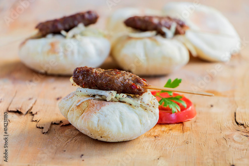 Traditional Adana kebap with Turkish bread bazlama