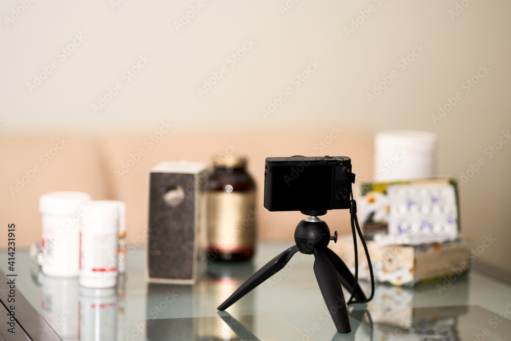 Blog about alternative medicine. Thematic attributes are laid out on the table in front of the camera. Selective focus.