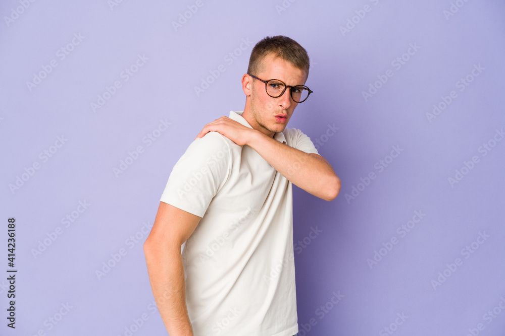 Young caucasian handsome man having a shoulder pain.