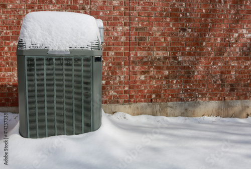 Modern high efficiency air conditioner under snow