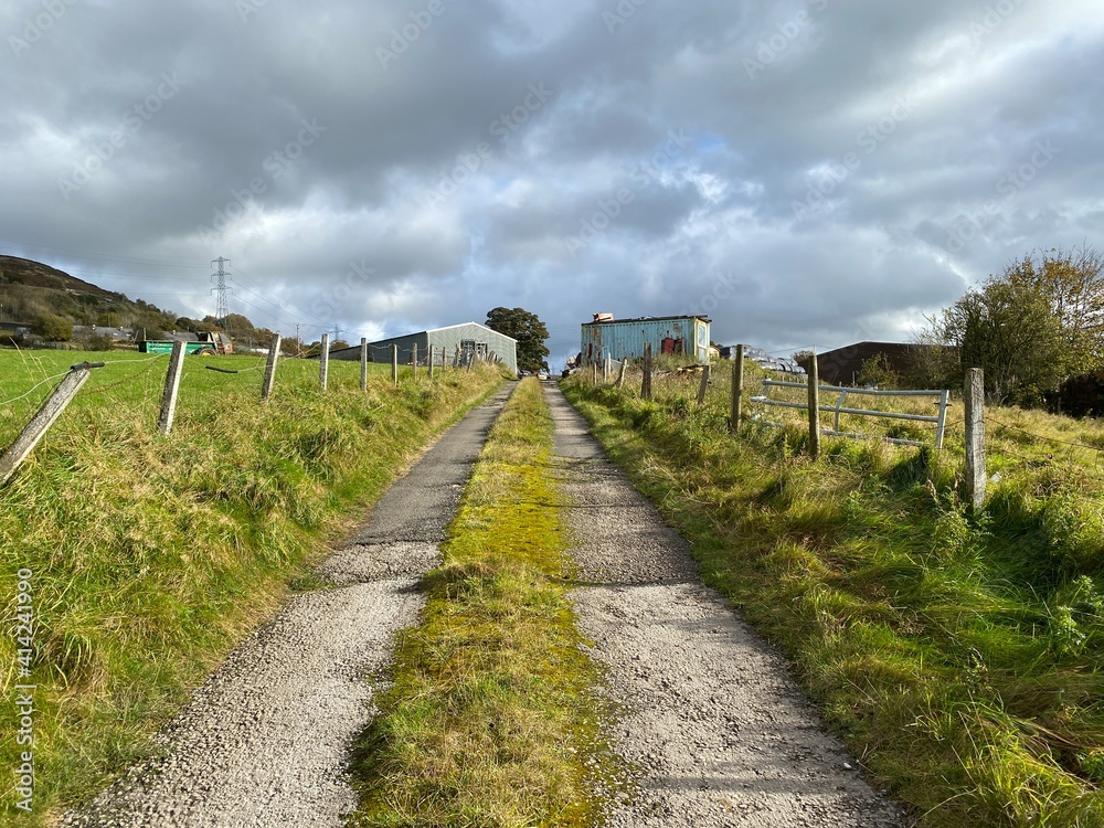 Cart track, leading to outbuildings, on a cloudy autumn day near, Old Lane, Halifax, UK