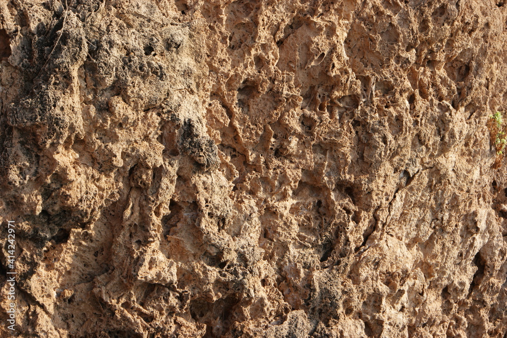 Rock formation texture. Natural eroded sandstone pattern. Erosion texture on rock formations. Rock surface close up.