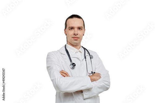 A young male doctor in a medical gown and with a phonendoscope around his neck. White isolated background.
