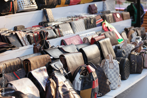 Tableau sur toile Showcase with fake handbags of famous brands