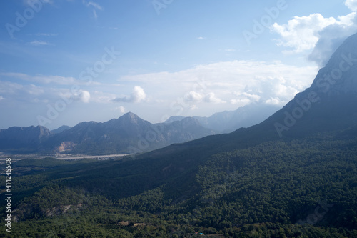 Beautiful mountain landscape with forests. View to forested mountain valley in the morning.