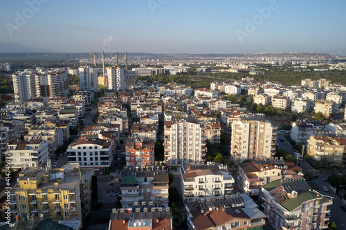 Modern city skyline, Antalya, Turkey. Aerial panoramic view of resort town with hotels and apartment buildings.
