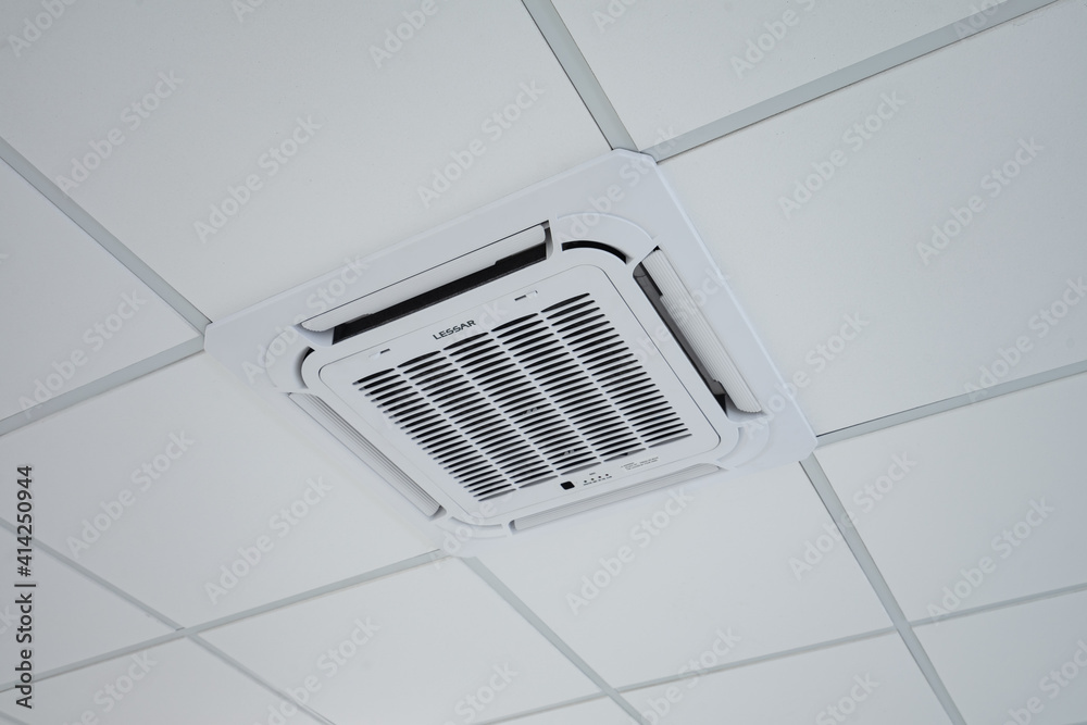 Ceiling mounted cassette type air conditioner Photos | Adobe Stock
