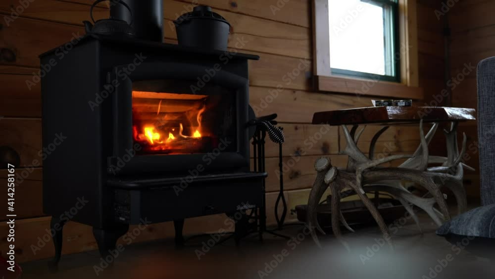 wood burning stove in a winter cabin wood burning stove in a winter cabin