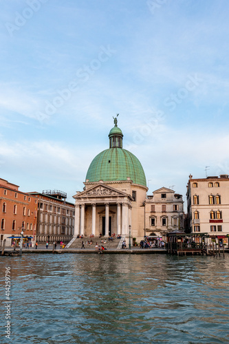 Venice's canal, boat and traditional Venetian houses view.  © Armensl
