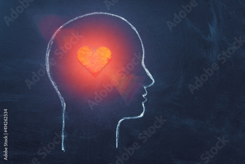 Shining Heart in human head. Love, instinct and romance concept. Chalk drawing. Copy space. Psychology, Valentine day, volunteer symbol.