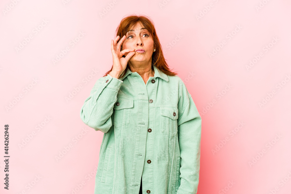 Senior caucasian woman isolated with fingers on lips keeping a secret. Senior caucasian woman isolated with fingers on lips keeping a secret.