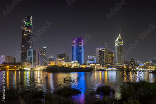 Modern architecture in downtown of Ho Chi Minh City, with river Saigon at nigh 