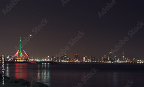 The Beautiful Skyline Of Kuwait City At Night Glitters With Light