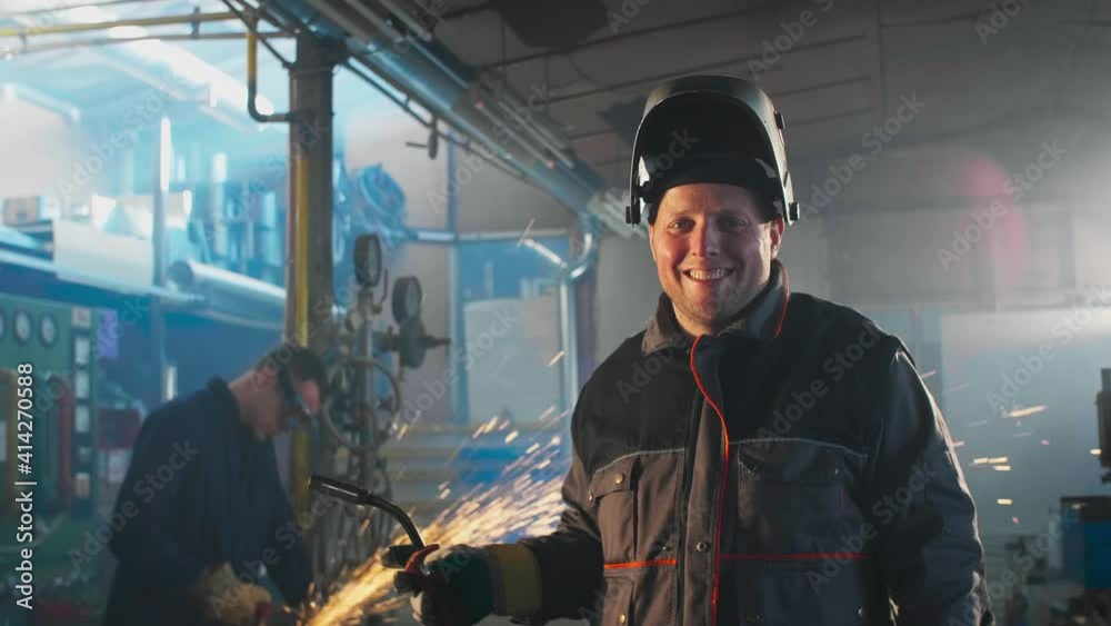 Portrait of a welder posing in a workshop Portrait of a welder posing in a workshop