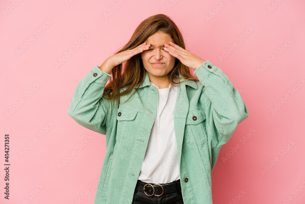 Young skinny caucasian teenager girl having a head ache, touching front of the face. Young skinny caucasian teenager girl having a head ache, touching front of the face.