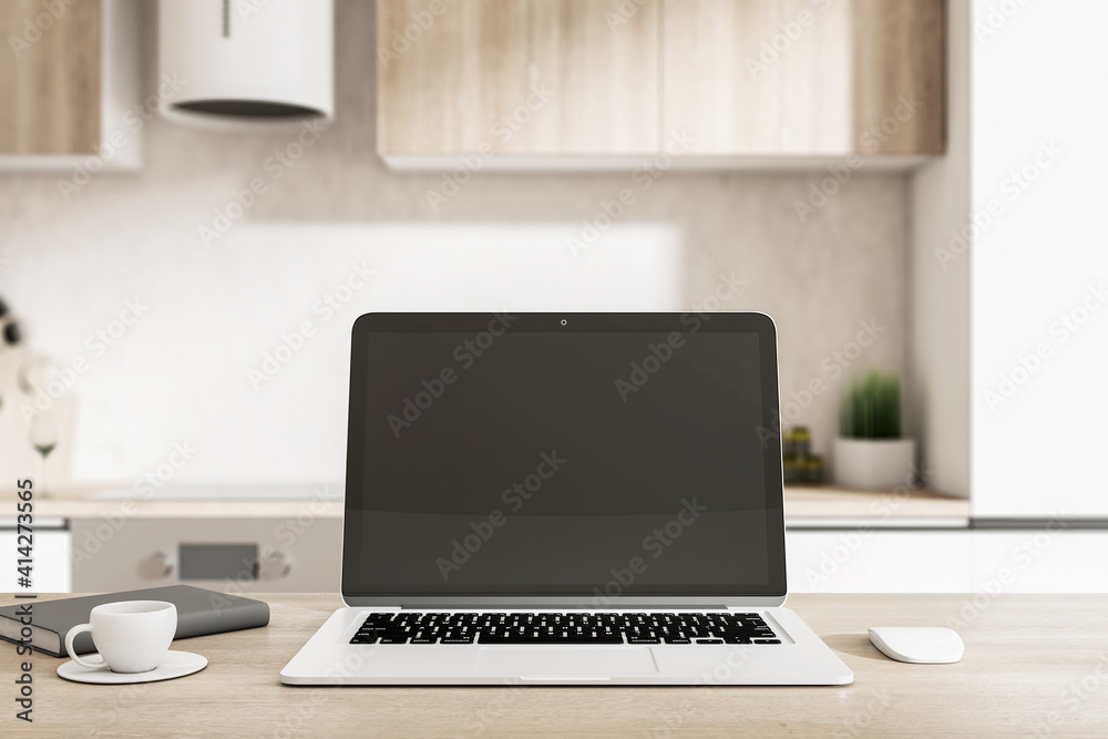 Remote working concept with blank black laptop screen in cozy kitchen interior with light furniture, black diary and mug of coffee. Mockup Remote working concept with blank black laptop screen in cozy kitchen interior with light furniture, black diary and mug of coffee. Mockup