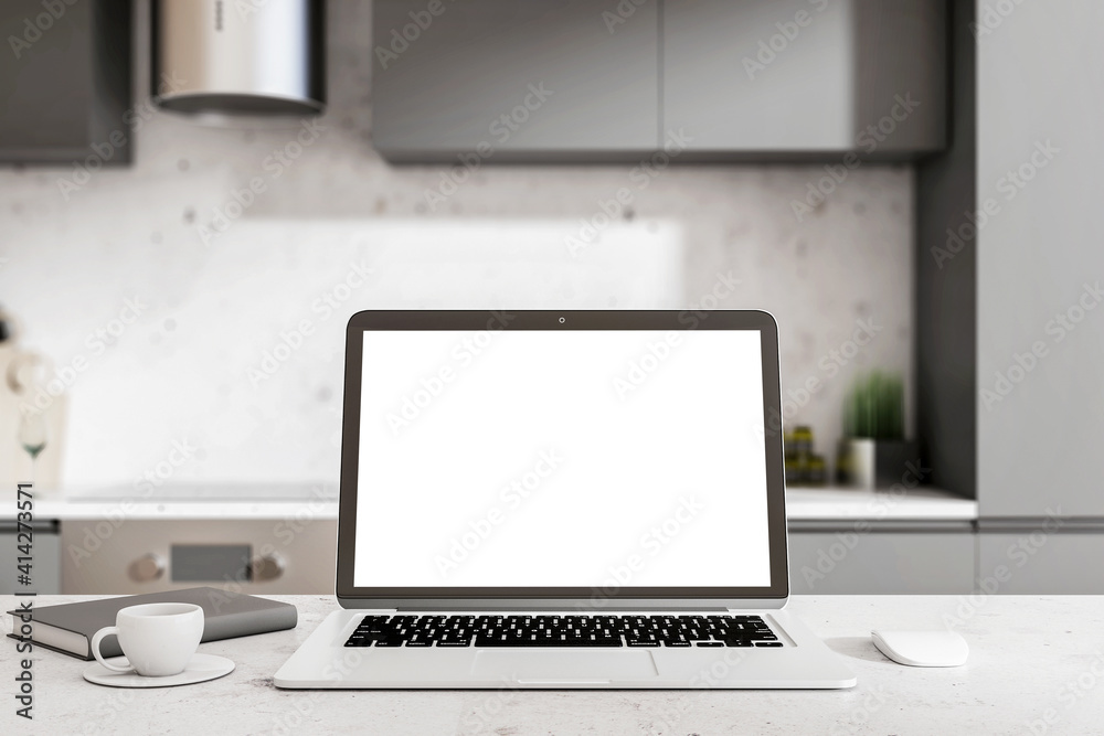 Working from home concept with blank white laptop display in the kitchen with dark furniture, black diary and cup of coffee. Mockup Working from home concept with blank white laptop display in the kitchen with dark furniture, black diary and cup of coffee. Mockup