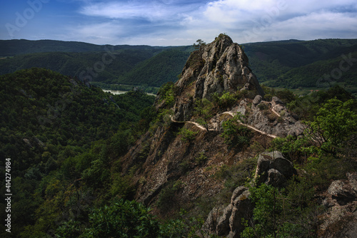 View of the Vogelbergsteig trail above the Danube river with views of the surrounding historic landscape of Dürnstein.