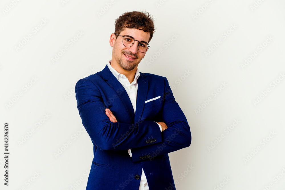 Fototapeta premium Young business caucasian man isolated on white background who feels confident, crossing arms with determination.