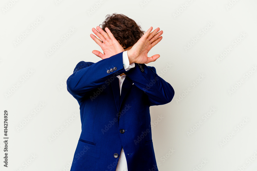 Young business caucasian man isolated on white background keeping two arms crossed, denial concept. Young business caucasian man isolated on white background keeping two arms crossed, denial concept.