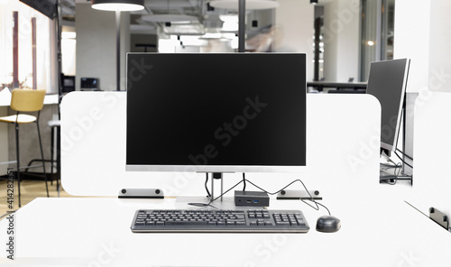 Desktop computer with portable system unit and keyboard and mouse in modern office