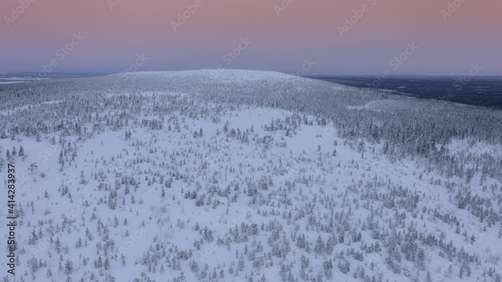 Snow covered forested hills and fells in Pyhä-Luosto National Park, Lapland, Finland, aerial drone shot Snow covered forested hills and fells in Pyhä-Luosto National Park, Lapland, Finland, aerial drone shot