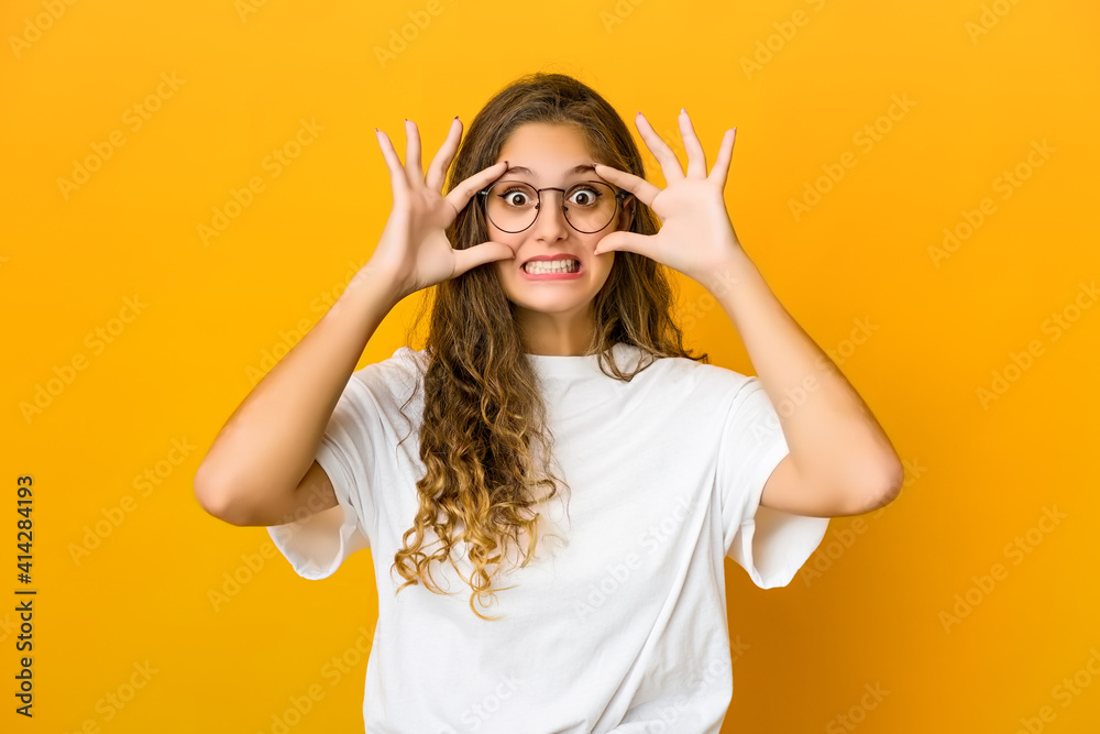 Young caucasian woman keeping eyes opened to find a success opportunity. Young caucasian woman keeping eyes opened to find a success opportunity.