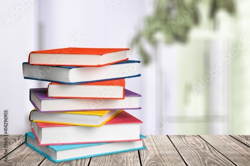 Stack of colorful books collection on the desk