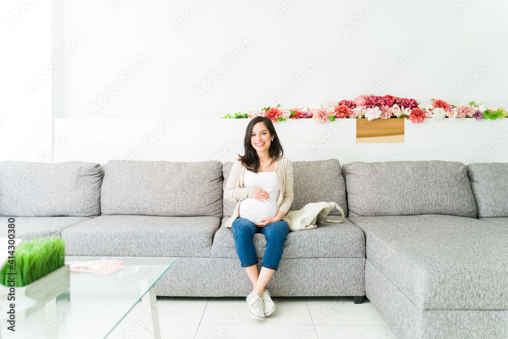 Beautiful expectant mother waiting at the gynecologist lounge Beautiful expectant mother waiting at the gynecologist lounge